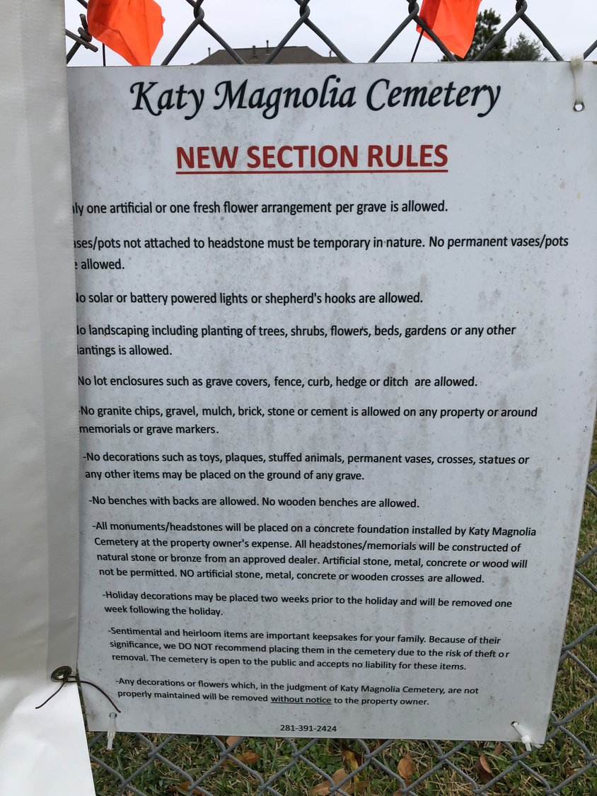 A sign placed at Katy Magnolia Cemetery announces rules for tending gravesites.